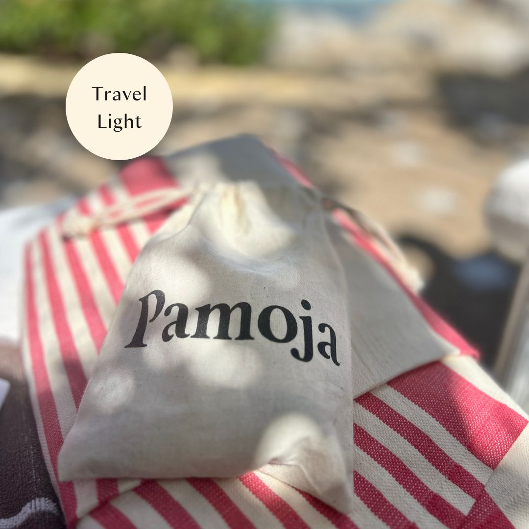 The Mini Experience mini skincare set on a towel on a sun lounger ready for keeping your skin glowing while you travel.