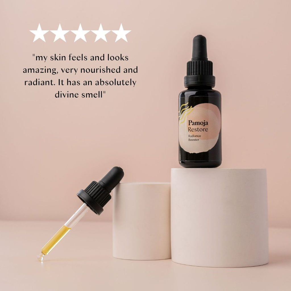 customer testimonial and star rating praising Restore Radiance Booster natural facial oil.
